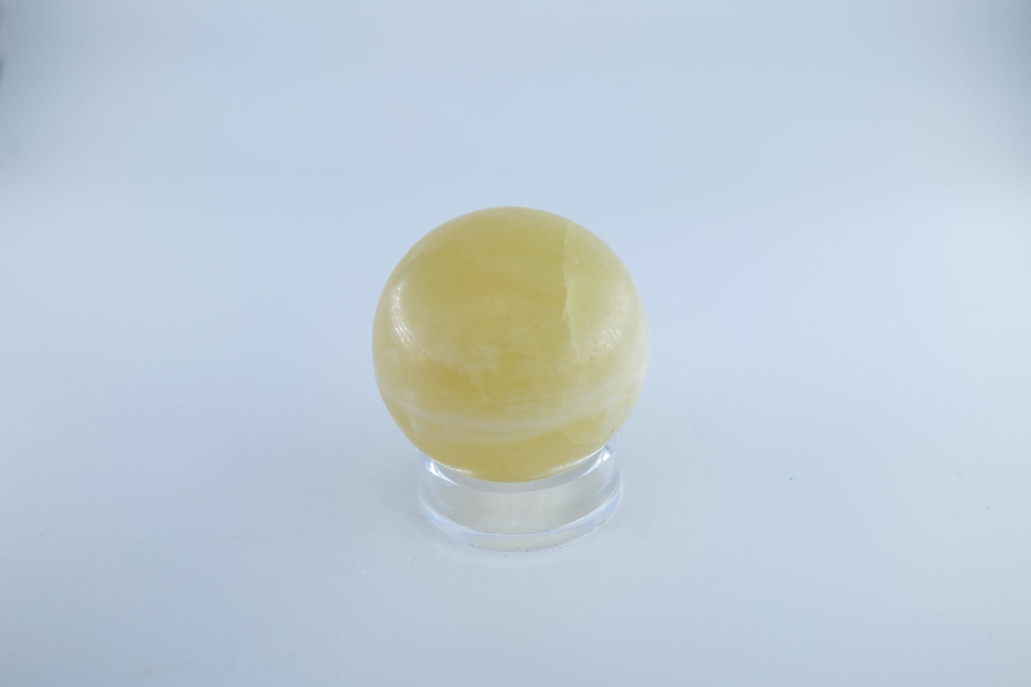 Polished Lemon Calcite Sphere 302 grams featuring soft translucent tone and gentle sheen - Luna Panther