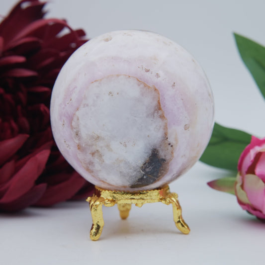 Polished Pink Aragonite Sphere 433g featuring warm brown star-like clusters - Luna Panther