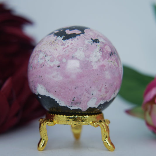 Polished Rhodochrosite Sphere – 249g, 52mm featuring pink bands and glassy finish - Luna Panther
