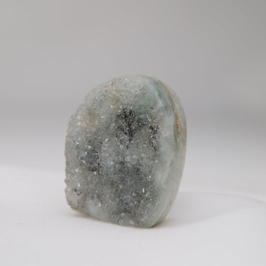 Angled Sugar Amethyst druzy face with fine grey crystals and a concentrated dark mineral patch. alternate view