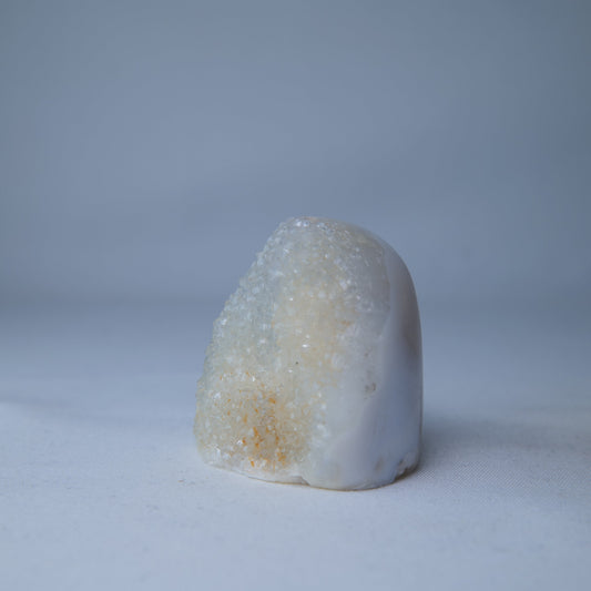 Sugar Amethyst Druzy 73g — A natural Sugar Amethyst druzy with a pale, sparkling crystal surface and polished display shape. Product image 2 of 6. alternate view
