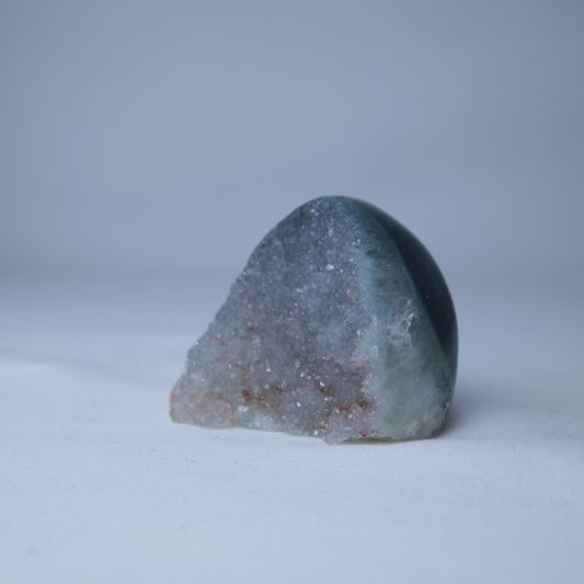 Sugar Amethyst Druzy 77g — A natural Sugar Amethyst druzy with a pale, sparkling crystal surface and polished display shape. Product image 2 of 8. alternate view