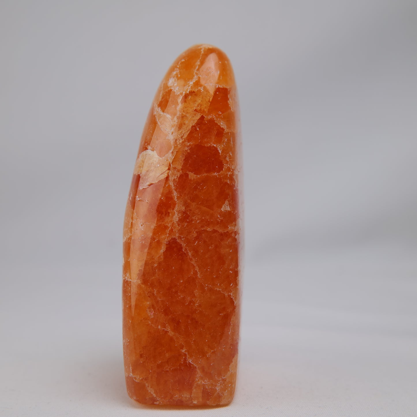 orange calcite freeform 328g front right view