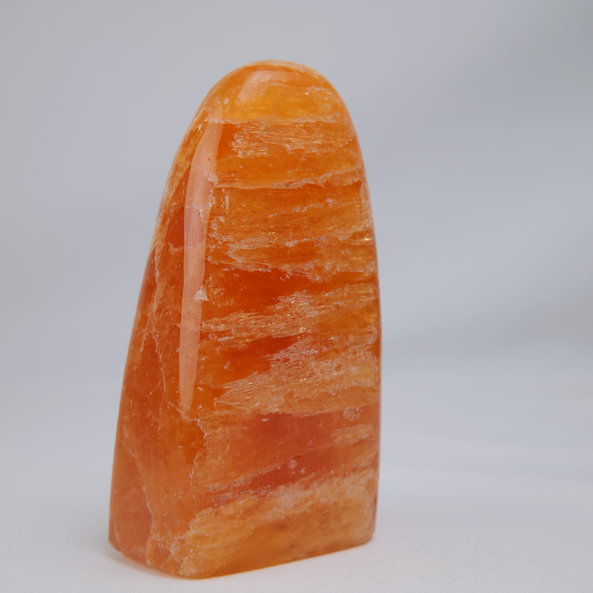 orange calcite freeform 328g reverse side view