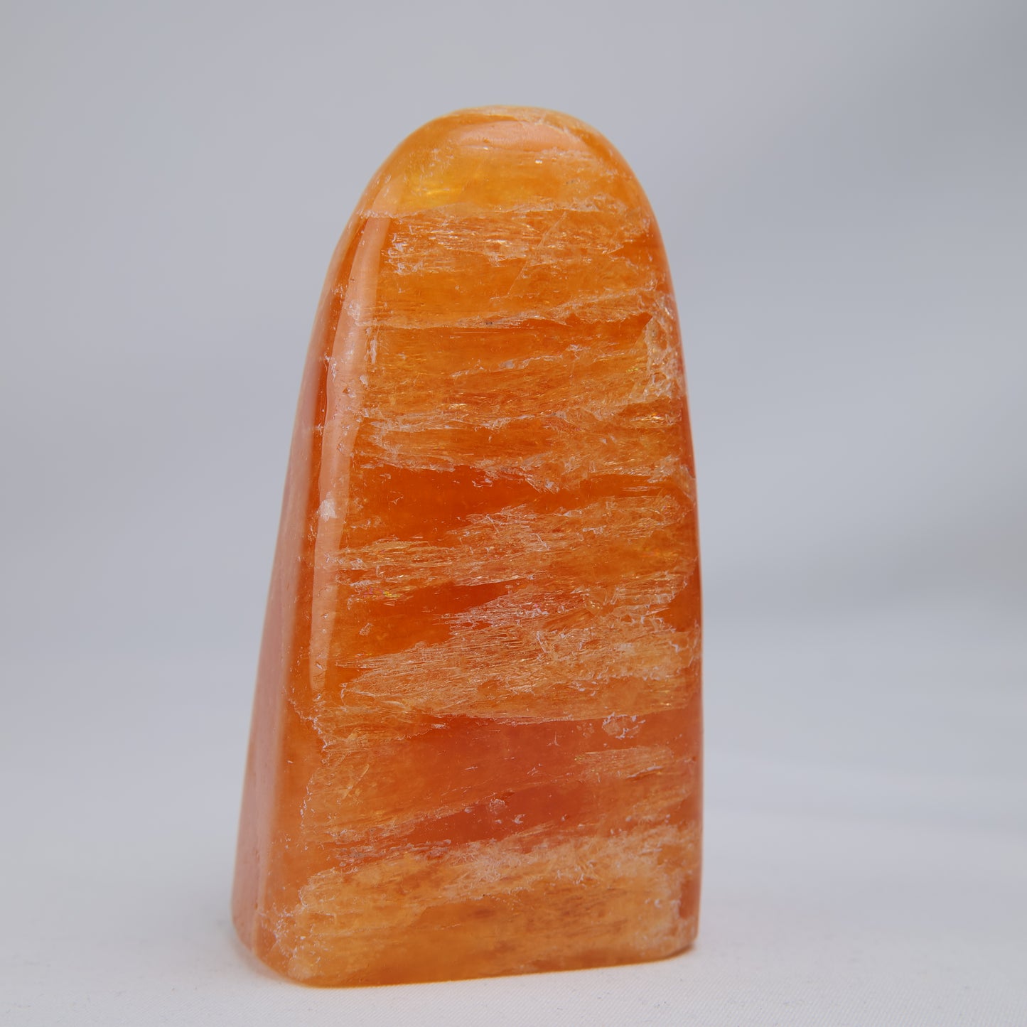 orange calcite freeform 328g back view