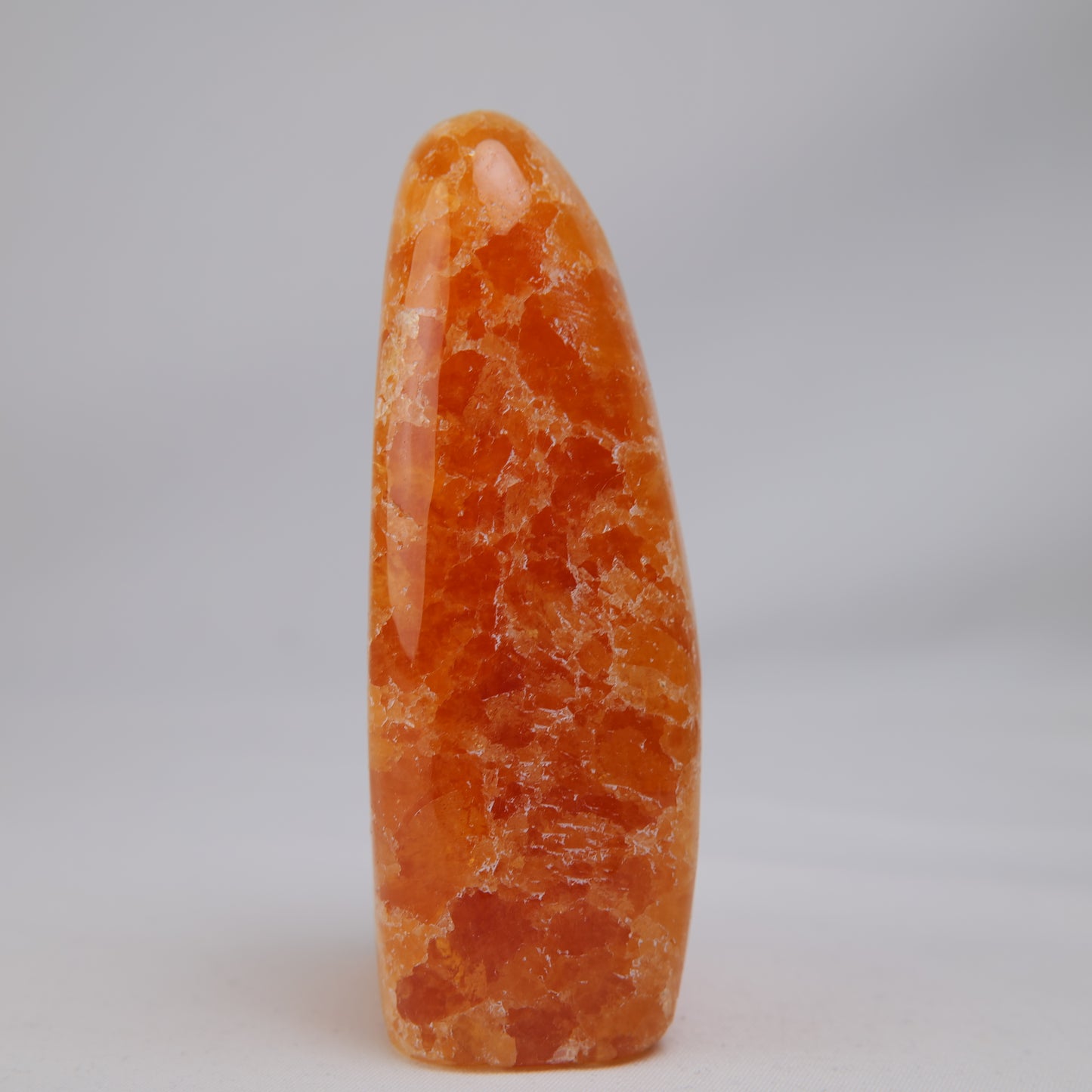 orange calcite freeform 328g golden detail