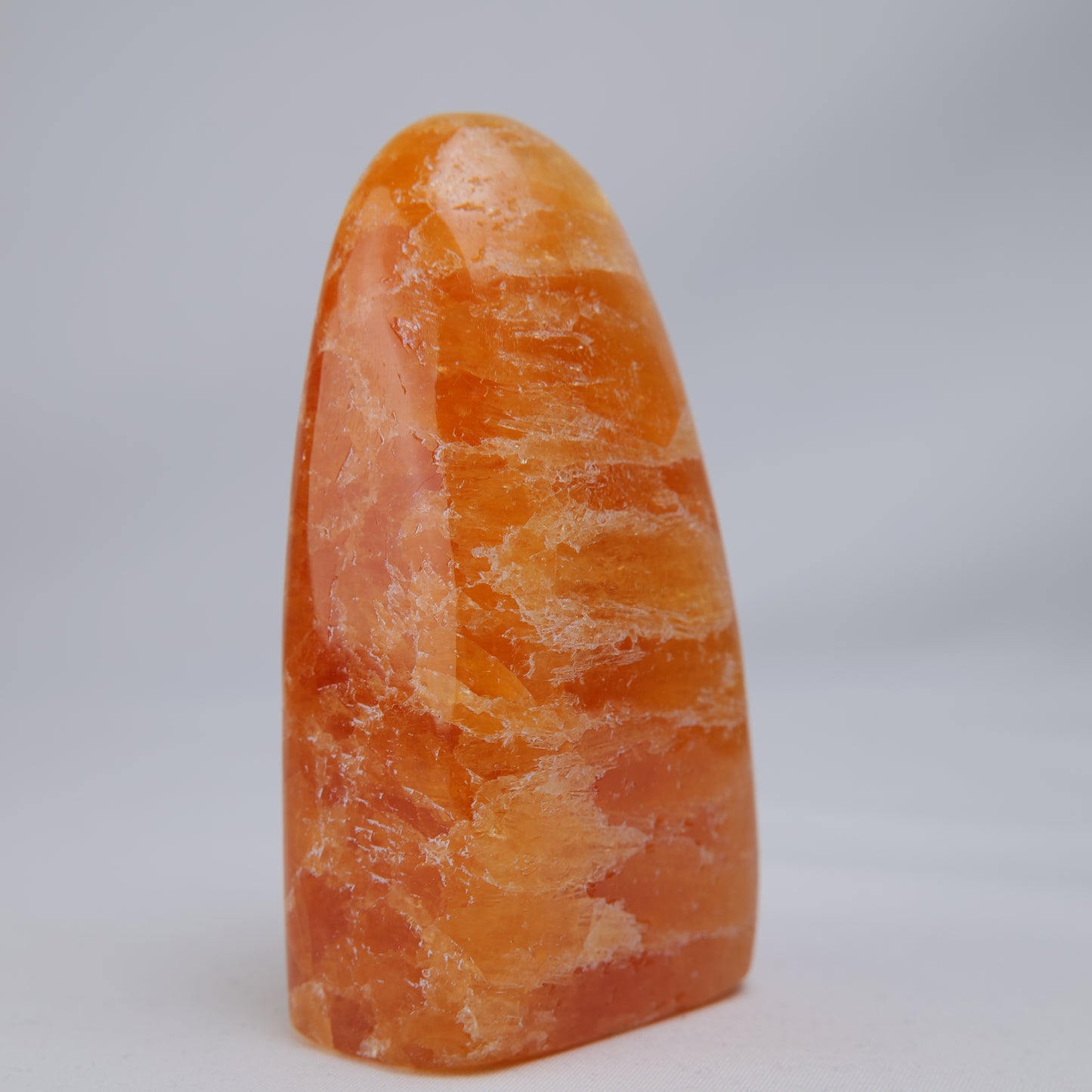 orange calcite freeform 328g natural banding detail