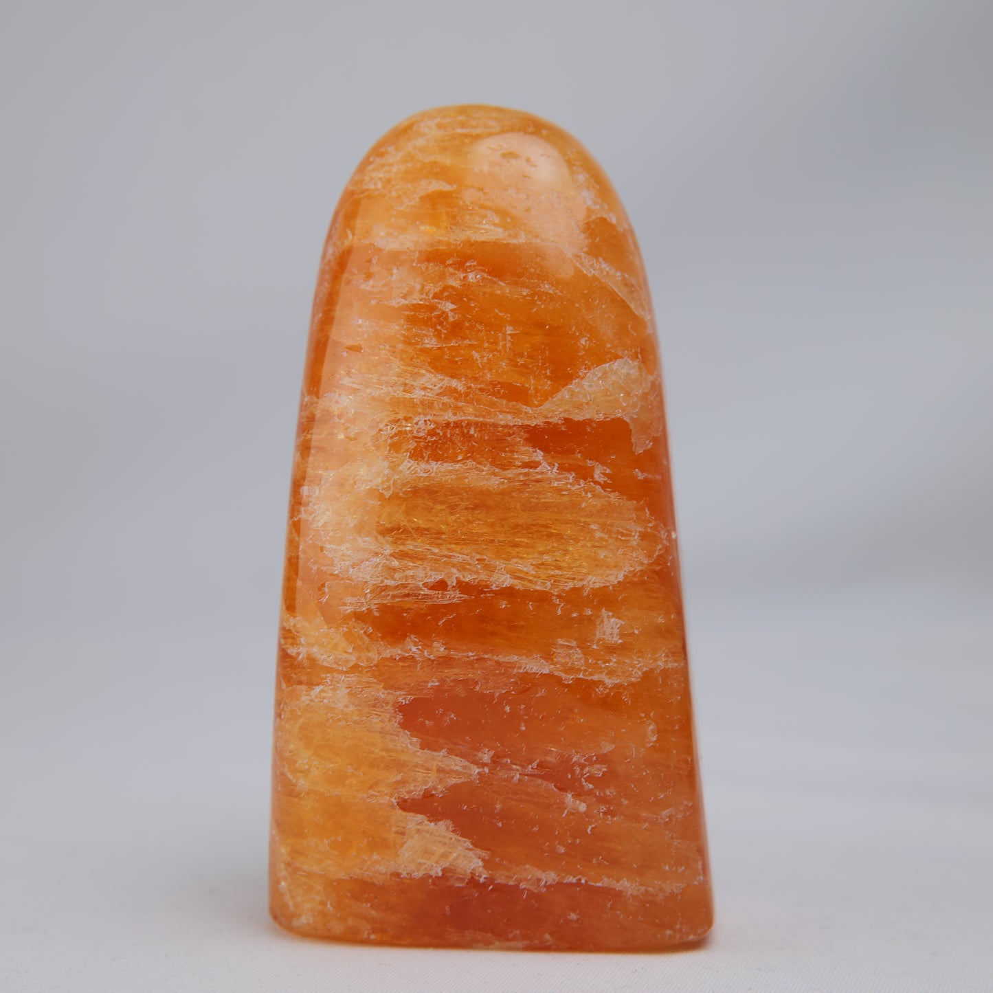 orange calcite freeform 328g polished detail