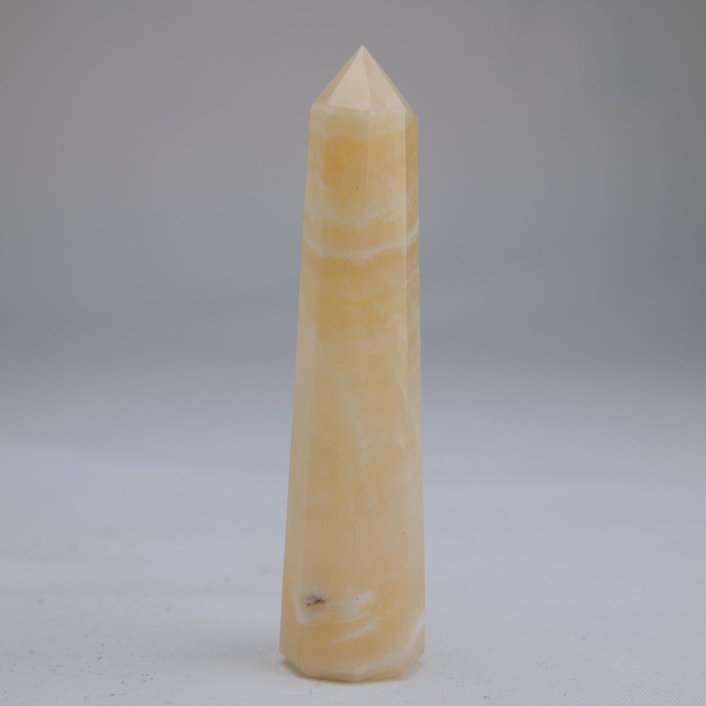 Yellow Banded Calcite Point 52g front