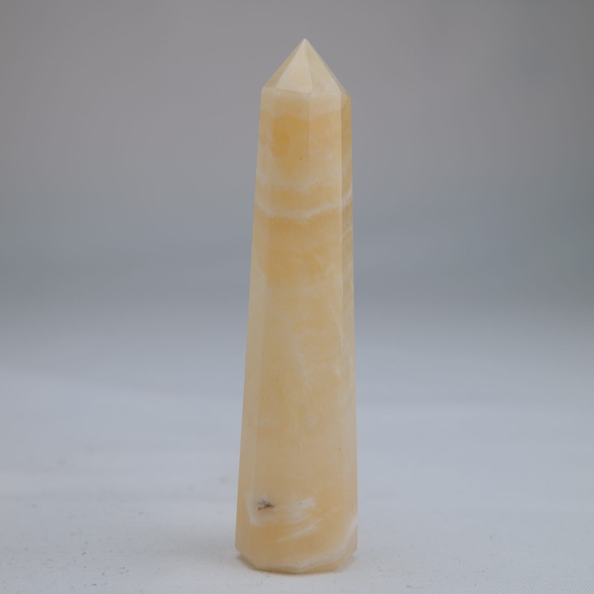 Yellow Banded Calcite Point 52g front