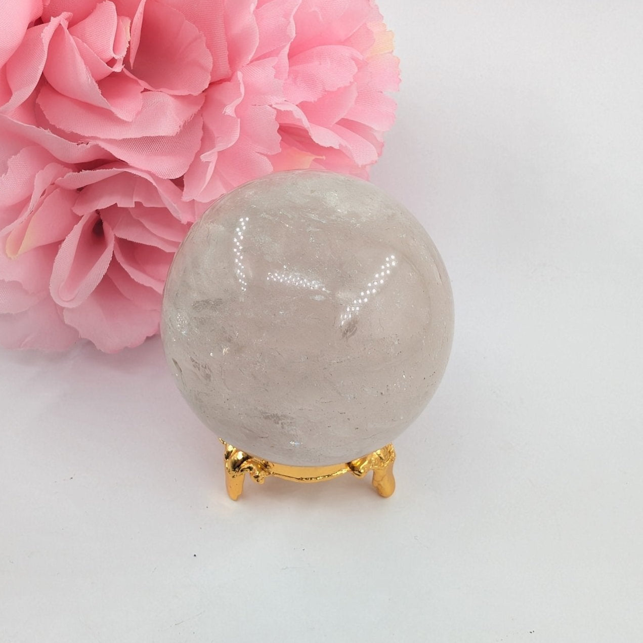 Polished Clear Quartz Sphere - 263g, 58mm featuring clear transparency and light-catching facets - Luna Panther