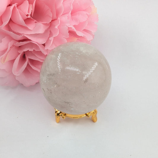 Polished Clear Quartz Sphere - 263g, 58mm featuring clear transparency and light-catching facets - Luna Panther