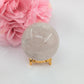 Polished Clear Quartz Sphere - 263g, 58mm featuring clear transparency and light-catching facets - Luna Panther