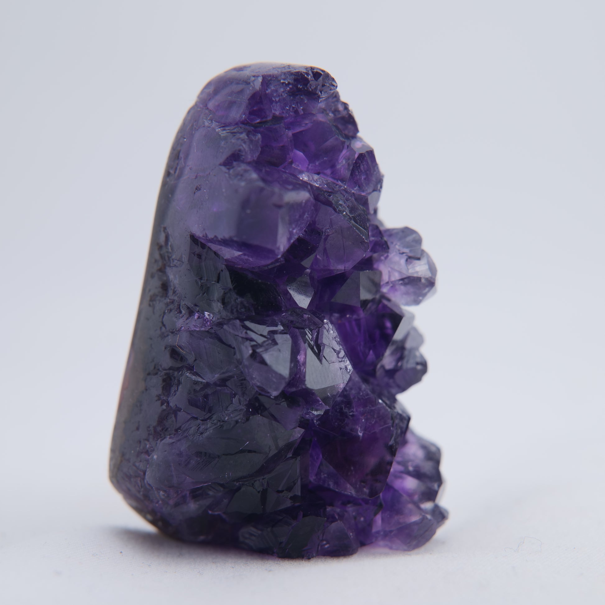 Matrix and polished edge detail on 74g Uruguay amethyst druzy point
