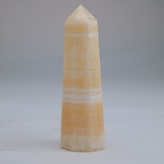 Yellow Banded Calcite Point 64g front