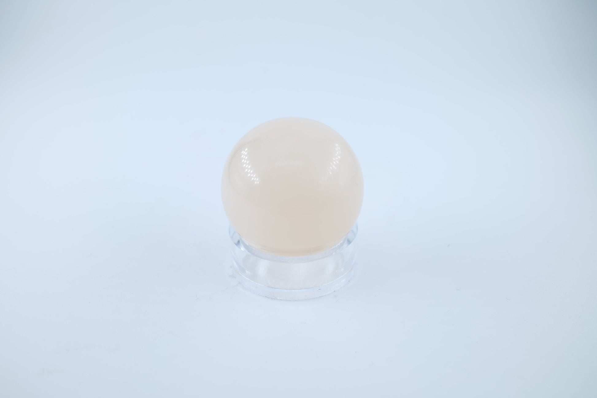 Polished Light Honey Calcite Sphere 170 grams featuring golden honey tone and glassy sheen - Luna Panther