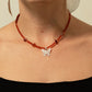 Nymph Ruby Gemstone Necklace with Real Leaf Butterfly Pendant — necklace, image 9 of 9.