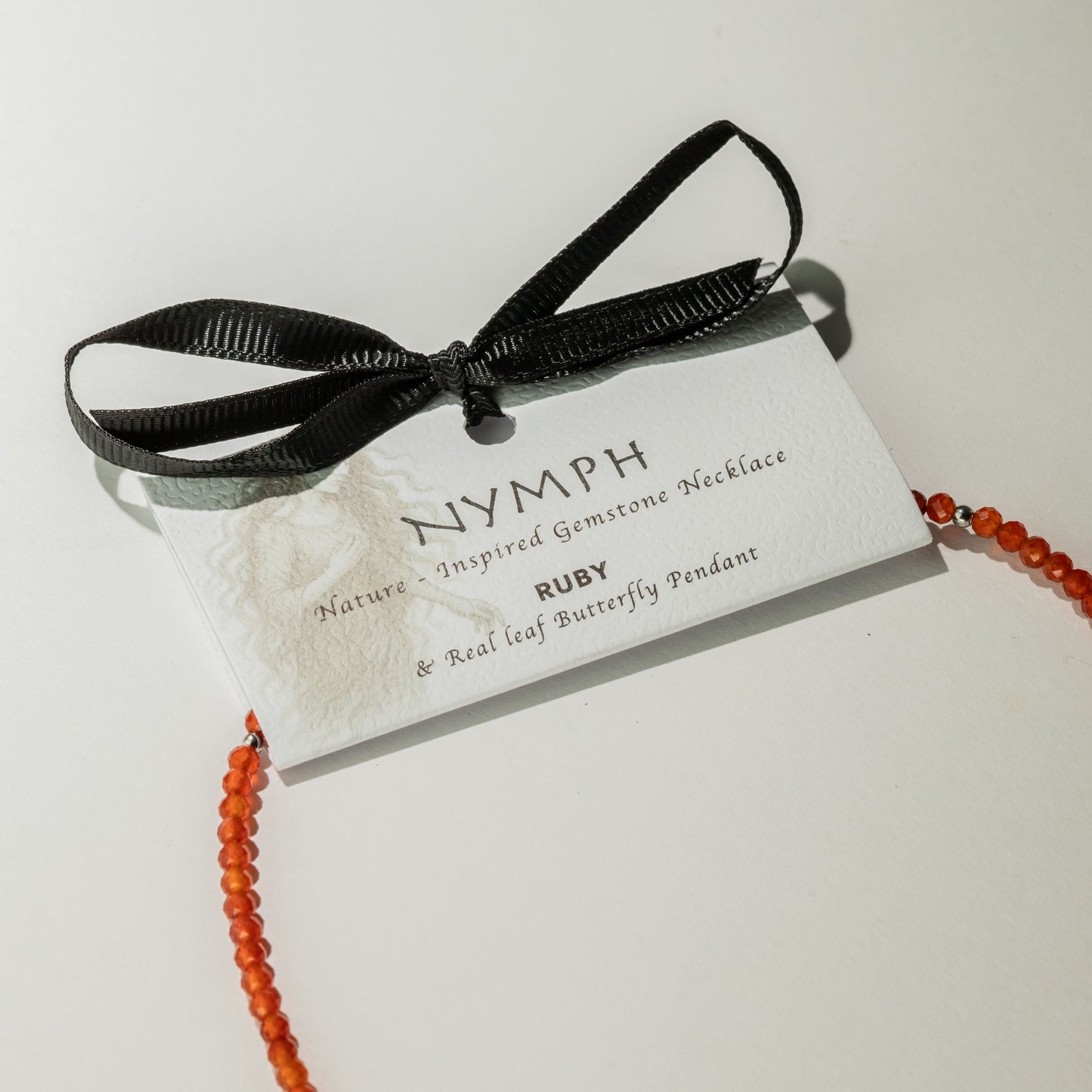 Nymph Ruby Gemstone Necklace with Real Leaf Butterfly Pendant — necklace, image 6 of 9.