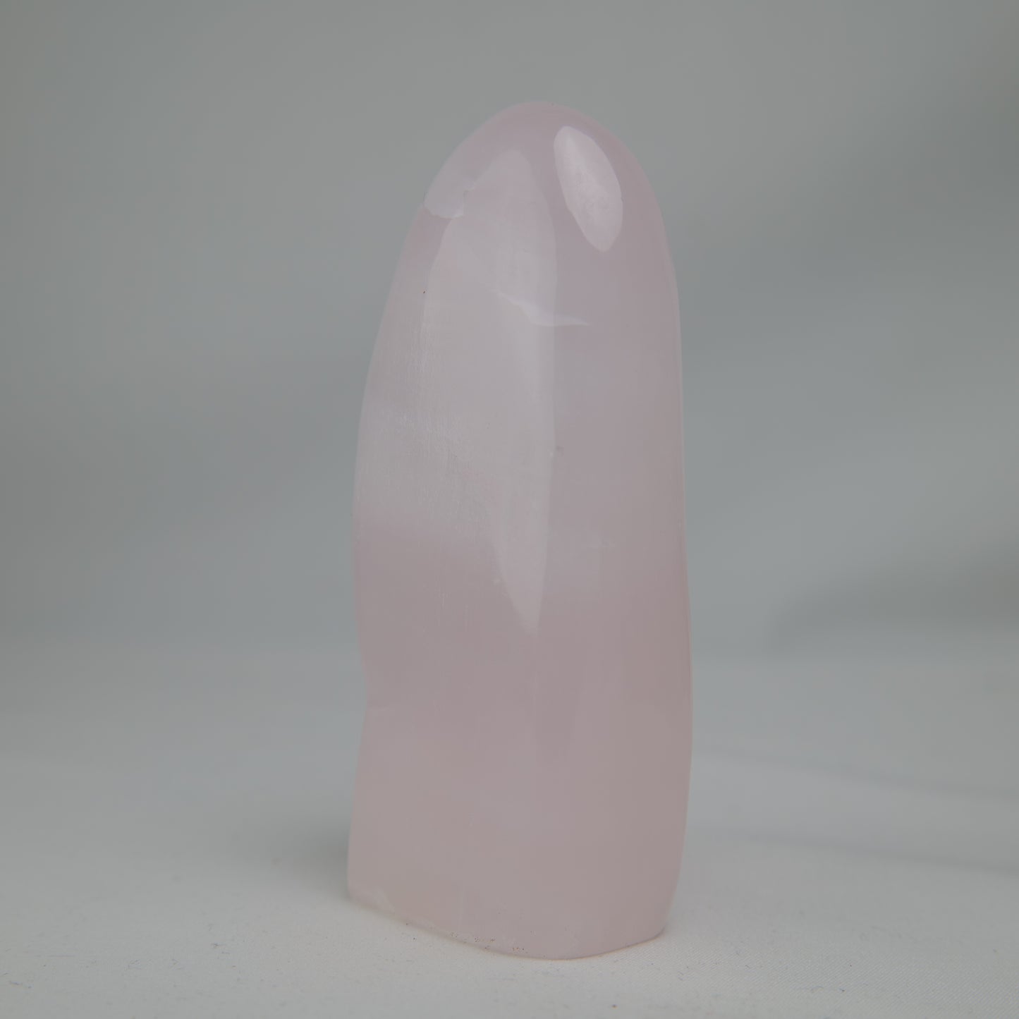 Pink Mangano Calcite freeform 313g polished front left view