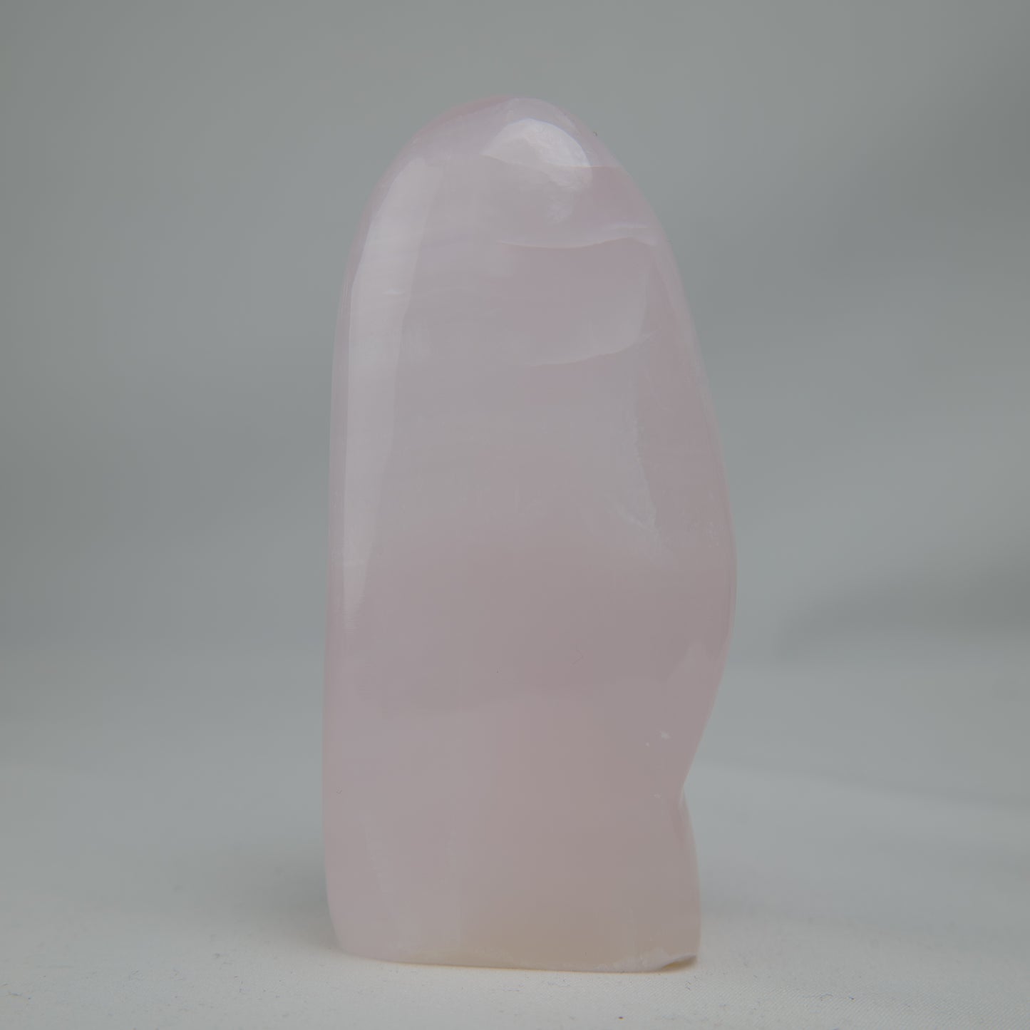 Pink Mangano Calcite freeform 313g polished reverse side view