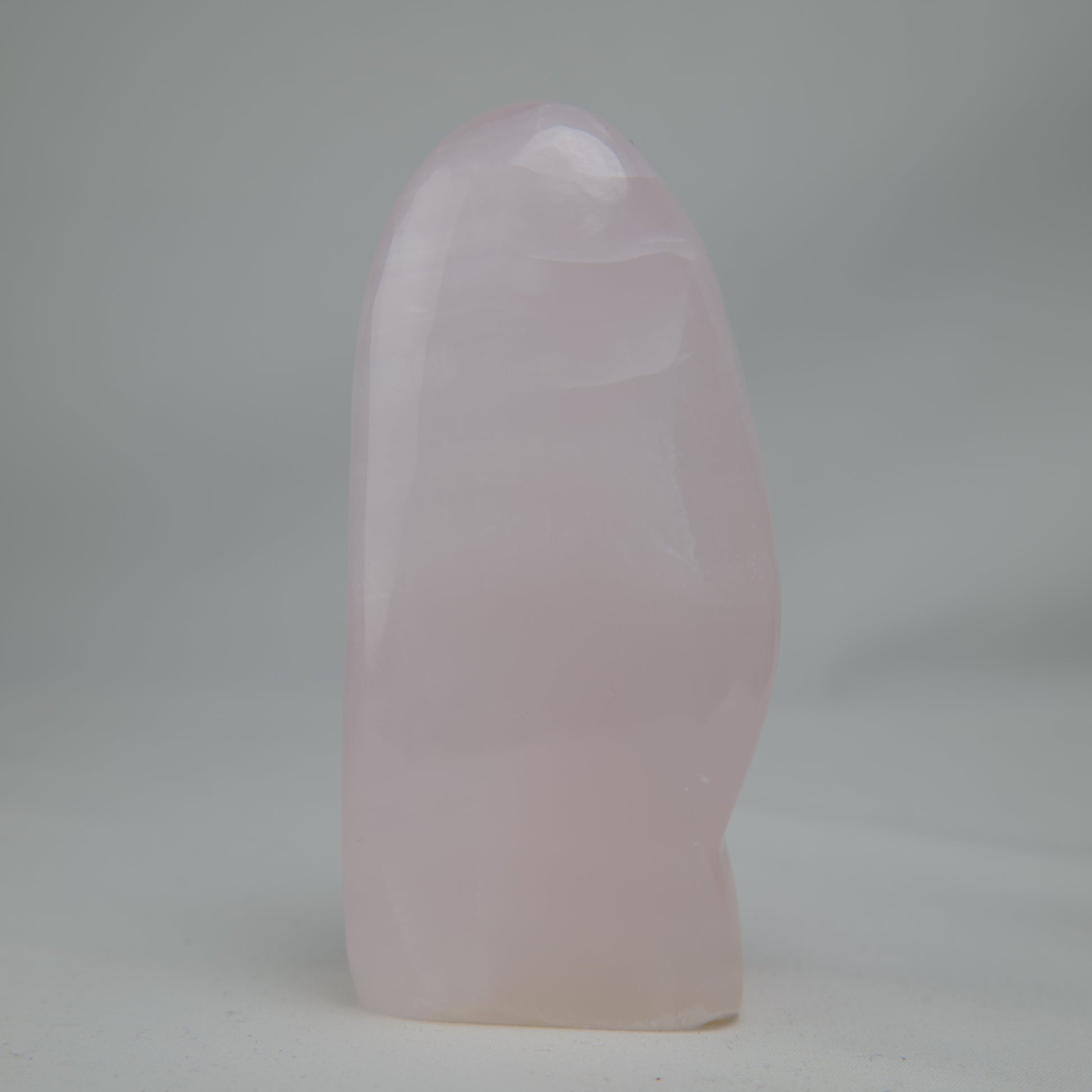 Pink Mangano Calcite freeform 313g polished reverse side view