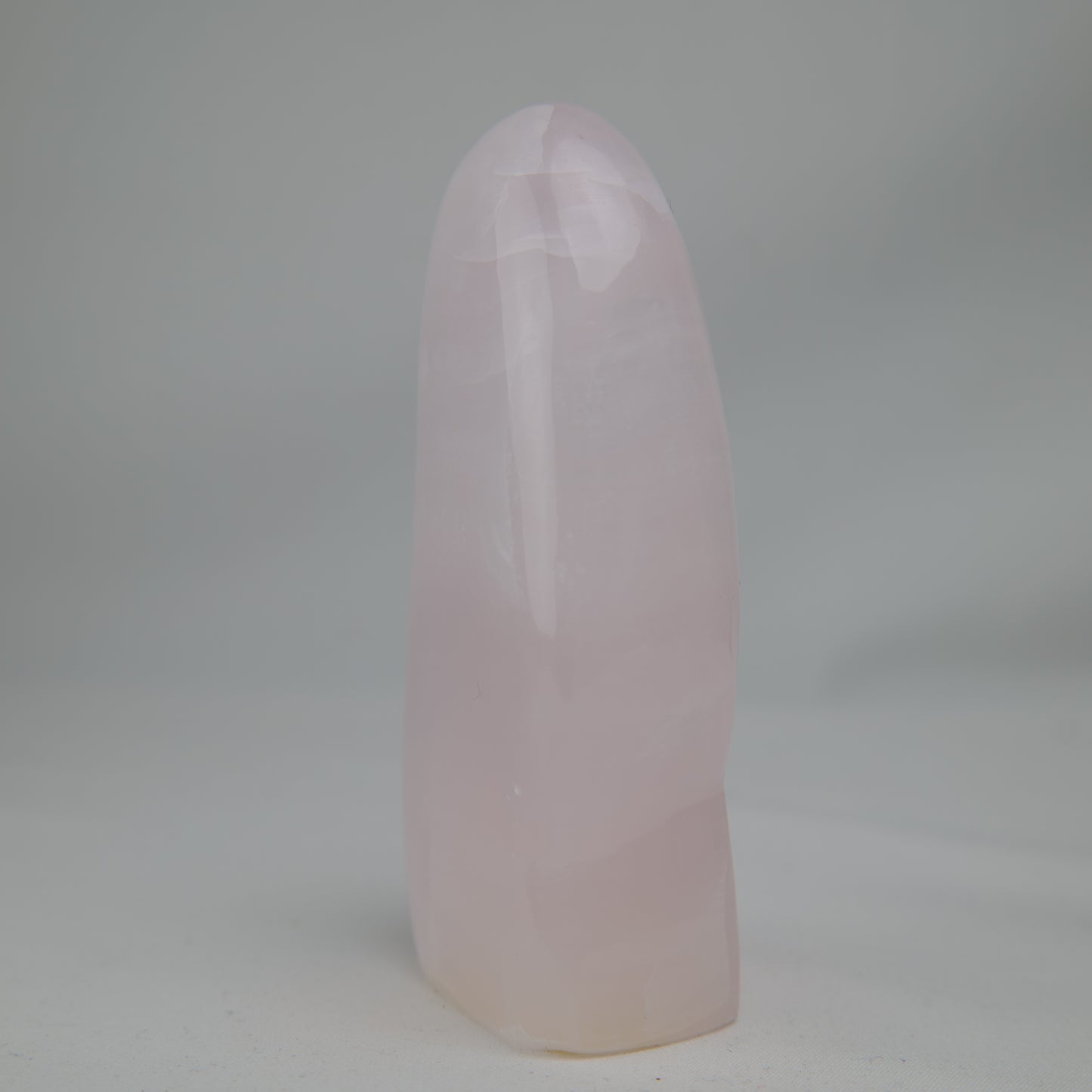 Pink Mangano Calcite freeform 313g polished side view