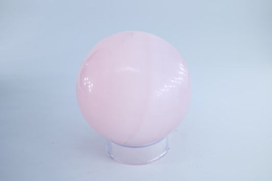 Polished Pink Mangano Calcite Sphere 665 grams featuring soft translucent tone and gentle sheen - Luna Panther