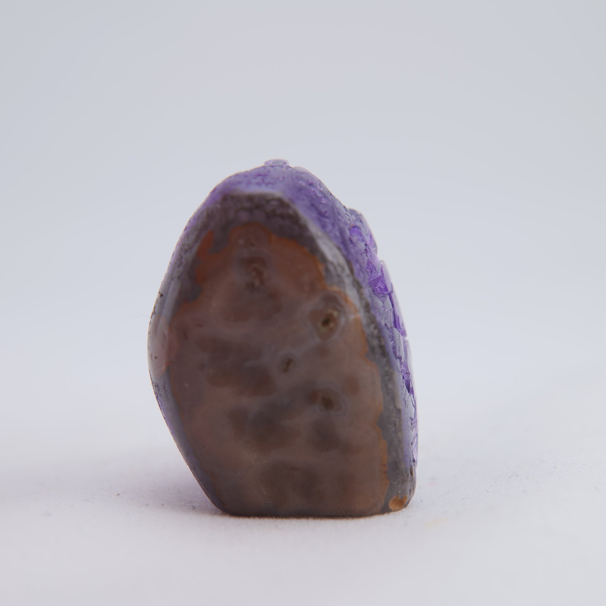 Polished agate backing on 34g Uruguay amethyst druzy point