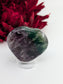 Polished Rainbow Fluorite Heart Palmstone 60mm featuring banded green‑purple hues and glassy clarity - Luna Panther