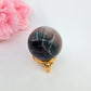 Polished Rainbow Fluorite Sphere - 167g, 47mm - Natural Inclusions featuring banded green‑purple hues and glassy clarity - Luna Panther