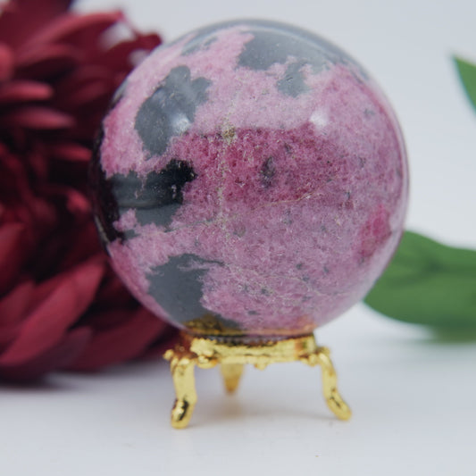 Polished Rhodonite Sphere Madagascar 712g featuring pink tone with black veining - Luna Panther