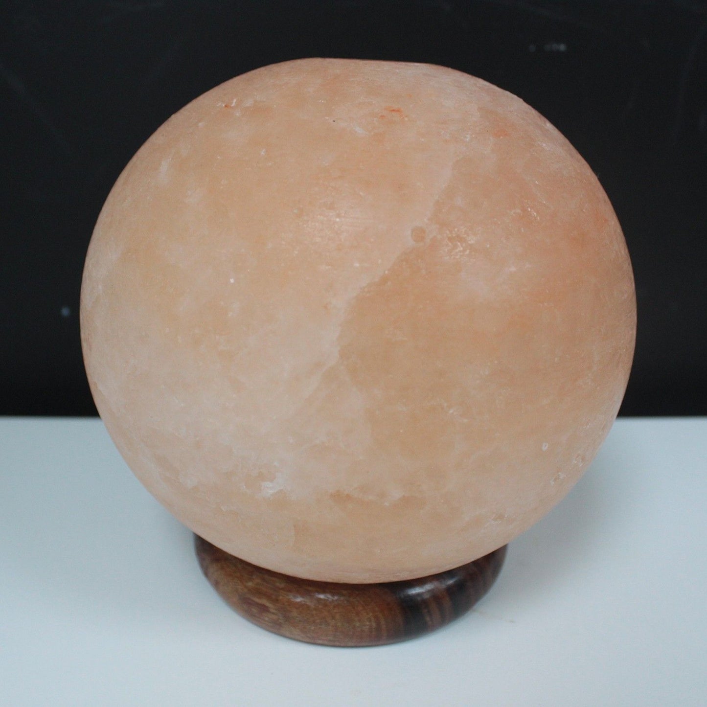 Polished Salt Lamp Ball Big Wooden Base 1 featuring natural patterning and unique variations - Luna Panther
