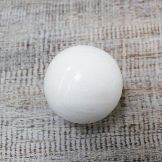 Polished Selenite Sphere - 5-6 cm featuring satin white sheen and fibrous texture - Luna Panther