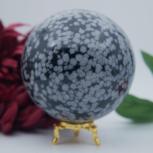 Polished Snowflake Obsidian Sphere 1192g featuring black base with grey snowflake patterns - Luna Panther