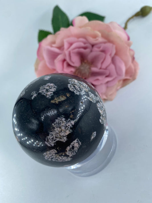 Polished Snowflake Obsidian Sphere 306 grams featuring black base with grey snowflake patterns - Luna Panther