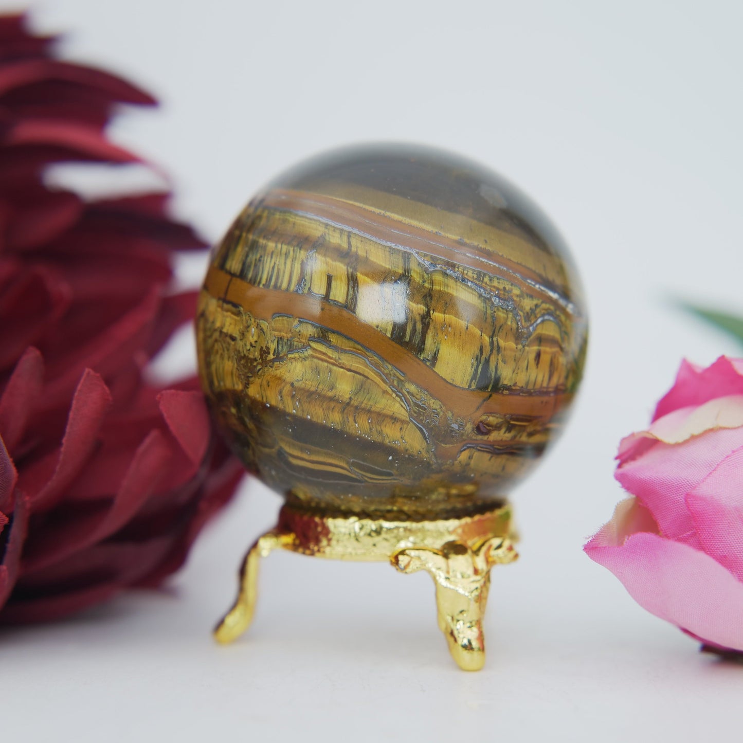 Polished Tigers Eye Sphere 205g 50mm featuring chatoyant golden-brown bands - Luna Panther