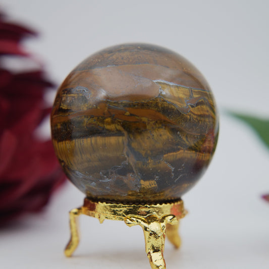 Polished Tigers Eye Sphere 210g 55mm featuring chatoyant golden-brown bands - Luna Panther
