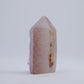 Side profile of small Uruguay amethyst druzy point with soft pink-lavender tones