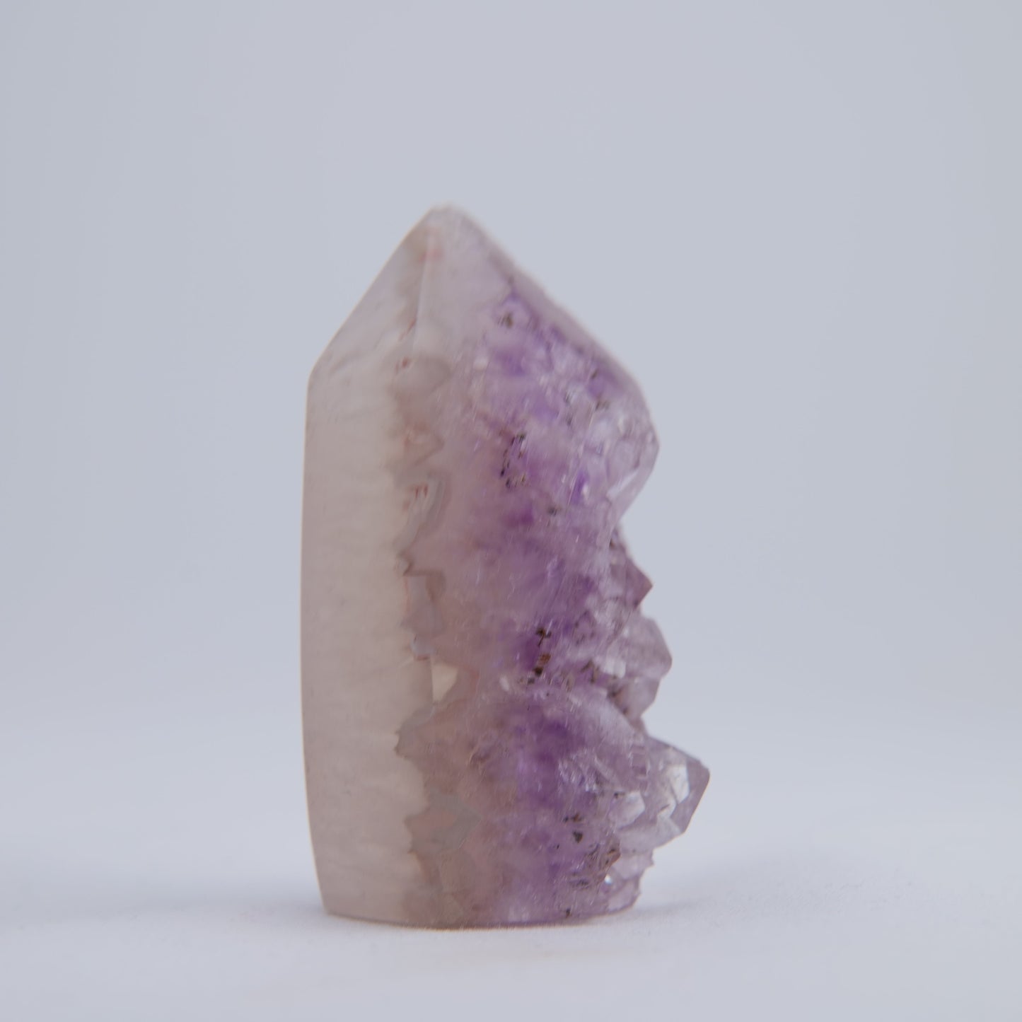 Close-up of sparkling druzy crystals on small Uruguay amethyst point